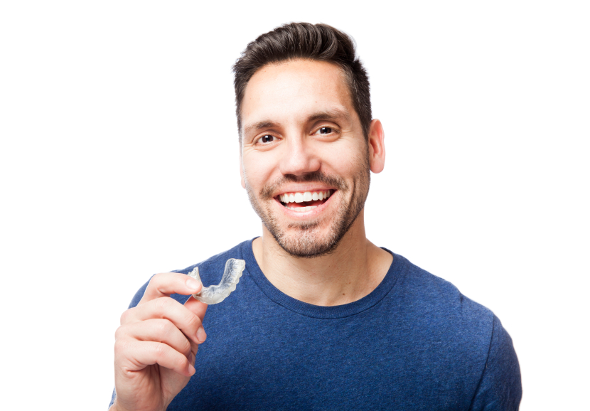 Man holding the invisalign clear braces tray. 